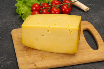 Hard yellow tasty cheese brick