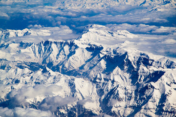 Obraz premium It's Beautiful panorama of the Alps covered with snow and clouds