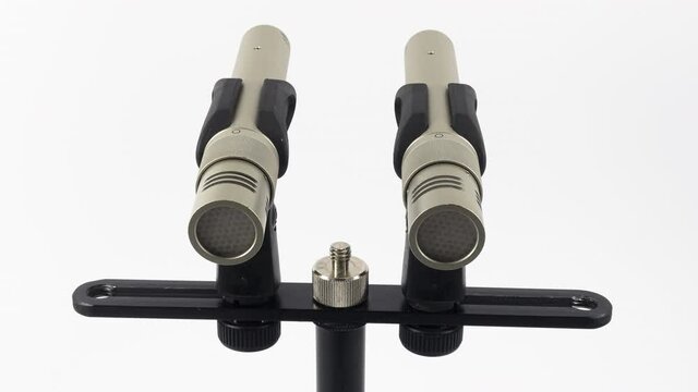 ZURICH, SWITZERLAND - MARCH 18, 2020: Animated stop motion of a pair of the small diaphragm condenser  microphones for studio recording.