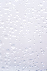 drops of pod on frosted glass