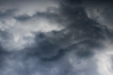 Obraz premium Blurry image of cloudy sky. Blue sky and dark clouds. Colorful nature background. 