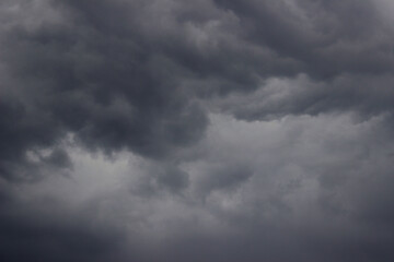 Fototapeta premium Blurry image of cloudy sky. Blue sky and dark clouds. Colorful nature background. 