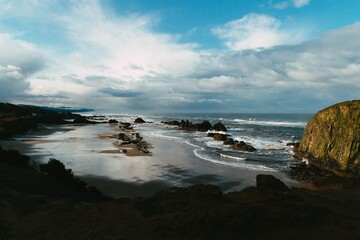 Landscape of the Seal Rock State Recreation Site surrounded by the sea under a cloudy sky in the US