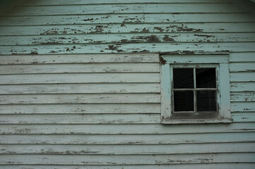 chipped painted white old house