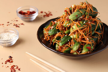 Traditional Korean kimchi snack: cucumbers stuffed with carrots, green onions, garlic and sesame, fermented vegetables, light background, horizontal format