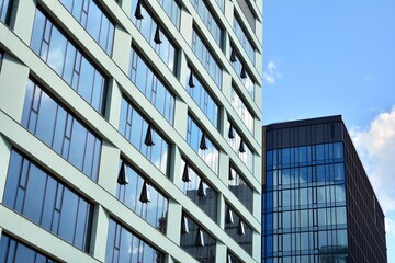 Facade texture of a glass mirrored office building. Fragment of the facade. Modern architecture of the office building.