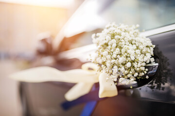 Wedding car decorated with flowers.