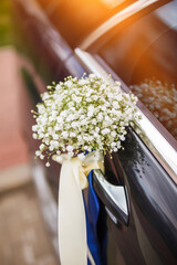 Wedding car decorated with flowers.