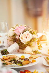 Delicate wedding bouquet of pink roses and peonies