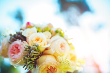 Delicate wedding bouquet of pink roses and peonies