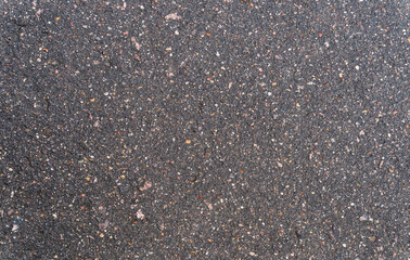 Grungy asphalt grunge surface, seamless asphalt, texture background, top view. Road repair, asphalt close up