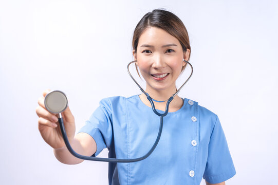 Portrait of smiling Asian nurse isolated on white background