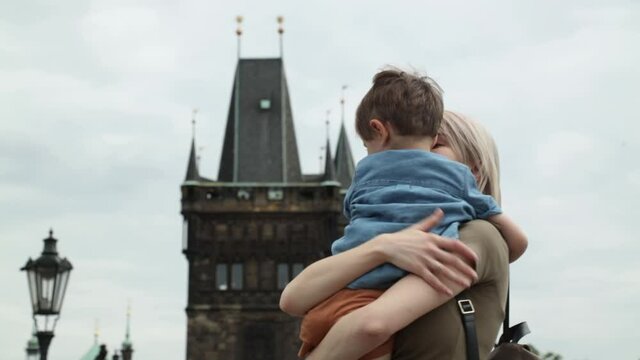 Mother and son at Charles bridge in Prague, Czech Republic