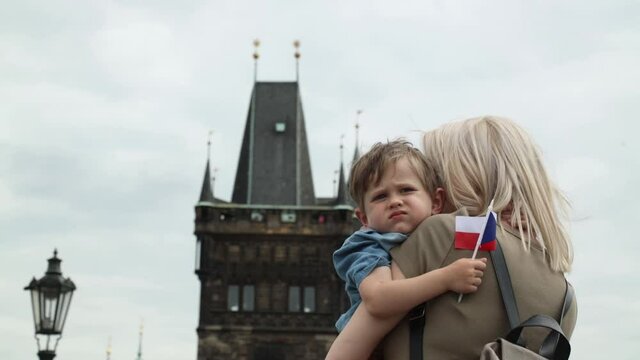 Mother and son at Charles bridge in Prague, Czech Republic