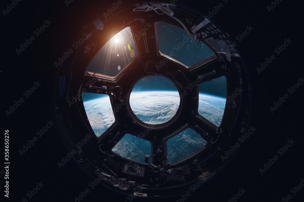 Poster view on earth planet from iss station porthole. space and sun. elements of this image furnished by n