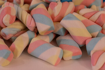 Different types of colorful marshmallows that decorate and give beauty to a party table.