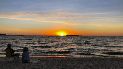 Sunset with two friends on the beach in Colonia, Uruguay
