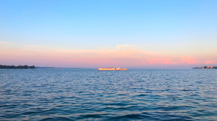 Sunset with a sightseeing boat in Lake Constance, Germany