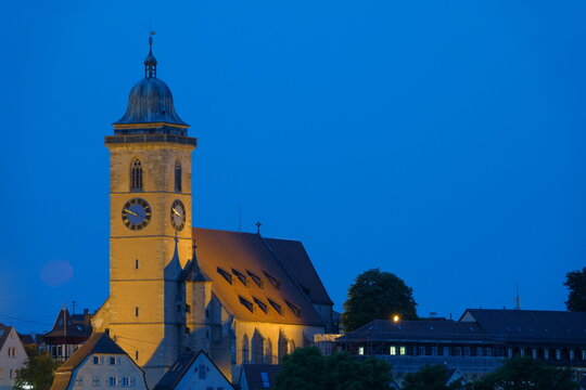 Laurentius church in Nuertingen, yellow tower and blue sky. Germany.