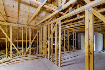 Unfinished roofing of interior view of a house residential construction framing against