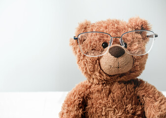toy teddy bear in glasses. eyesight concept. children vision and eye care. oftalmology and eyeglasses clinic. learning and study. education and back to school.