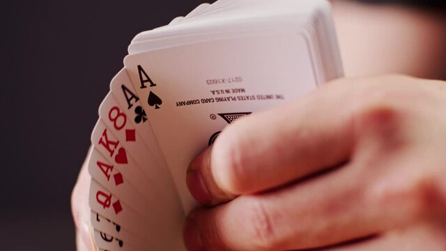 Playing cards fan with motion (close-up)