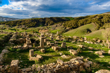 Fototapeta na wymiar Nature and ruins of Djemila, the archaeological zone of the well preserved Berber-Roman ruins in North Africa, Algeria. UNESCO World Heritage Site