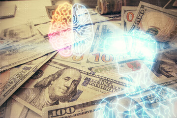 Double exposure of man wearing VR glasses drawing over usa dollars bill background. Concept of virtual reality.