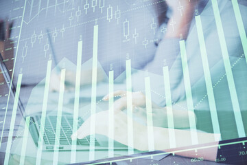 Multi exposure of woman hands typing on computer and financial chart hologram drawing. Stock market analysis concept.