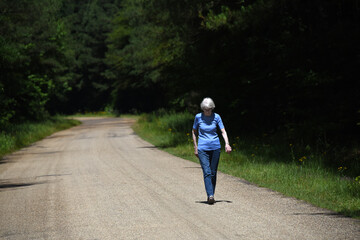 Elderly Woman Walks for Exercise