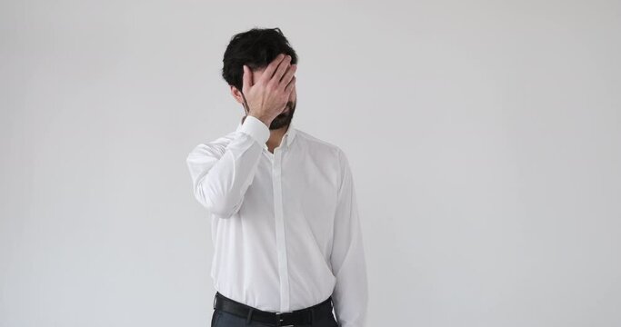 Businessman regretting his wrongdoing over white background