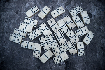 old shabby dirty dominoes scattered on the surface