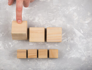 Man hand turned empty wooden cube