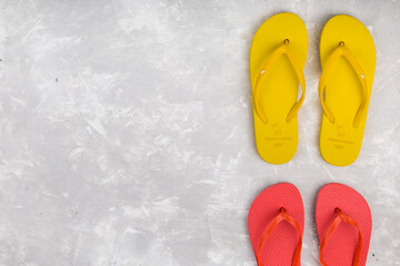 Summer flip flop shoes on grey background