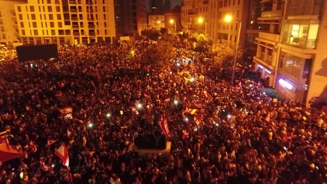 Beirut, Lebanon 2019 : night drone shot of Martyr square, during the Lebanese revolution, with thousands of protesters revolting against government failure and corruption