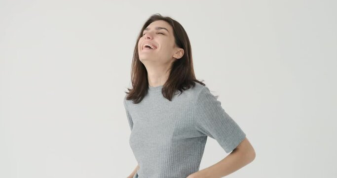Woman laughing on funny joke over white background