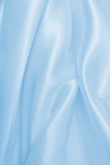 Fototapeta premium Smooth elegant blue silk or satin luxury cloth texture as abstract background. Luxurious background design