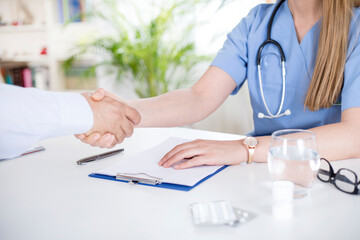 woman doctor talking with patient