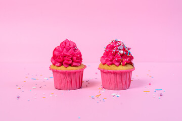 fresh homamde pink cupcakes on pink background