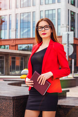 sexy successful confident business woman standing near corporate office