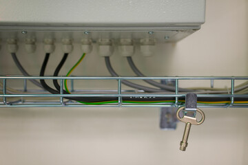 Electrical cabinet key hanging in electrical substation.