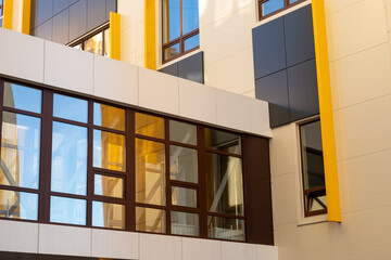 Fragment of a glassed-in pedestrian crosswalk between buildings. Use of modern finishing materials...