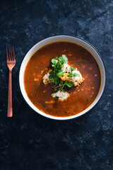 plant-based food, vegan lentil soup with caulini and broccolini and vegan cream cheese topping