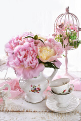 bouquet of pink peonies in porcelain jug