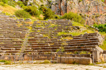 It's Amphitheater in Delphi, an archaeological site in Greece, at the Mount Parnassus. Delphi is famous by the oracle at the sanctuary dedicated to Apollo. UNESCO World heritage