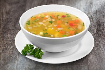 Bowl of delicious vegetable soup on a table