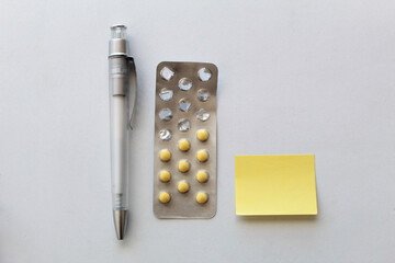 Pen, pills and note
