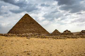 Obraz na płótnie Canvas It's Ruins of the Great Pyramids at the Giza Necropolis, Giza Plateau, Egypt. UNESCO World Heritage