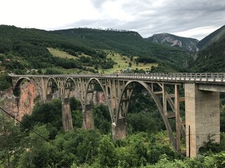 Fototapeta na wymiar Djurdzhevich bridge over the river Tara in the mountains Montenegro
