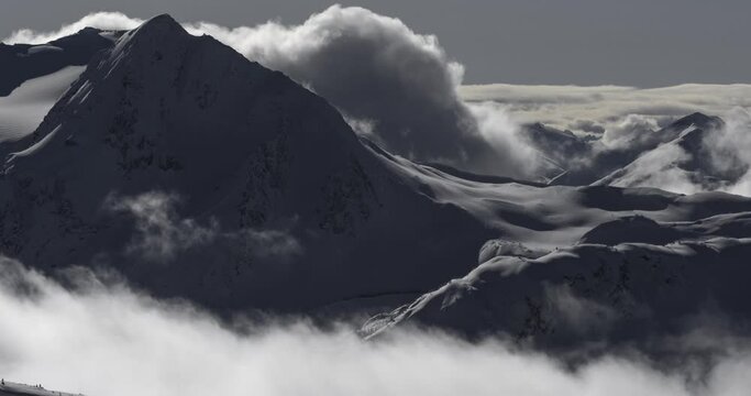 4K timelapse of mountain mist rising and clouds in the Coastal Mountains, Garibaldi Provincial Park, British Columbia, Canada at sunrise